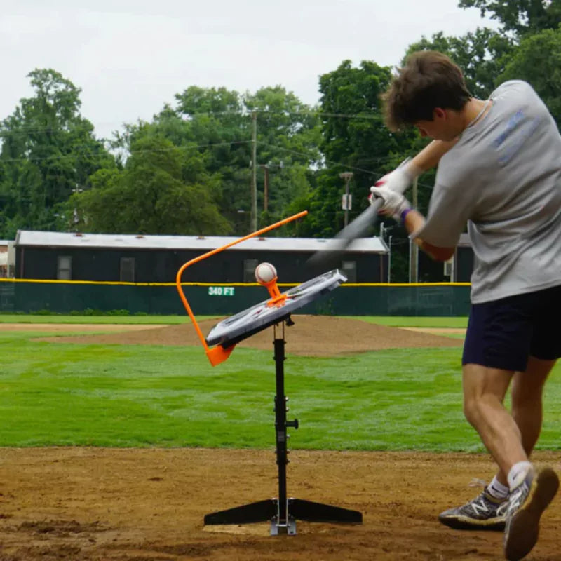 Baseball hitter training with Perfect Swing tool to improve swing accuracy and batting performance.