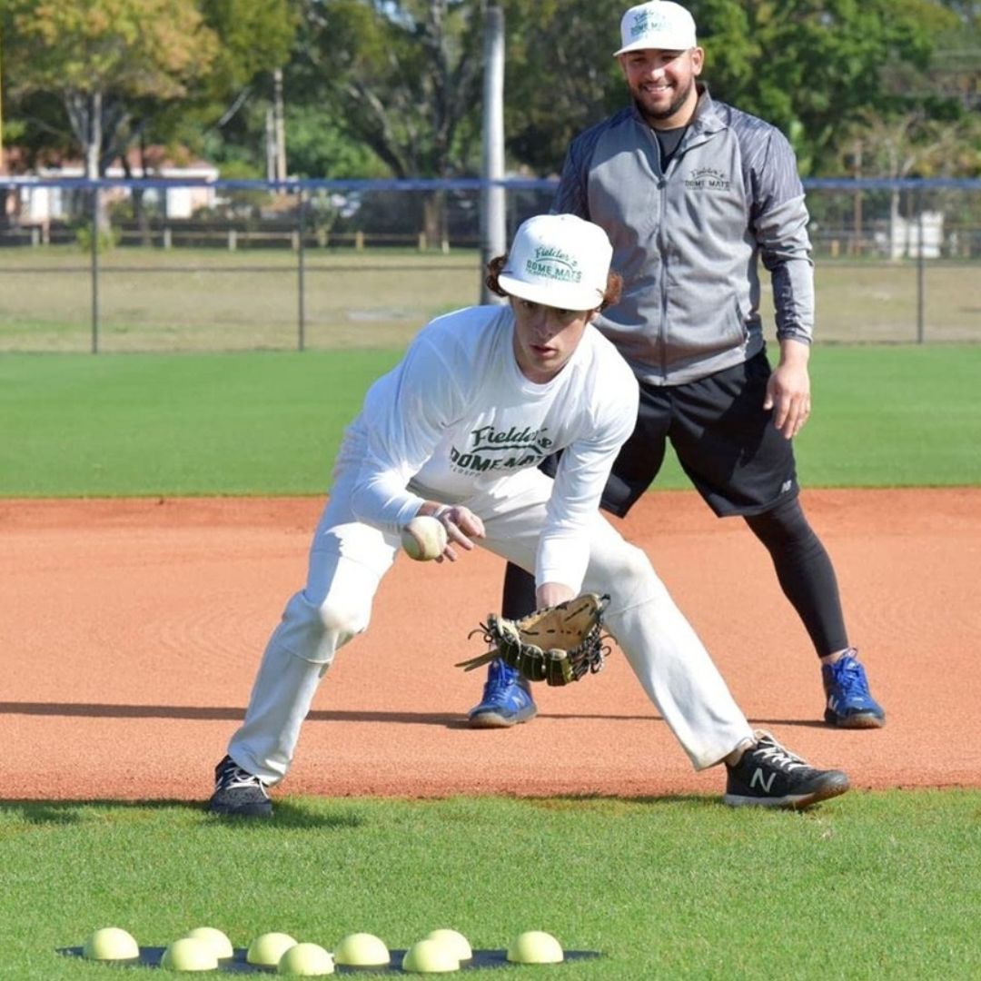Fielding dome mat used by coaches to develop proper footwork, glove control, and defensive consistency for infielders.