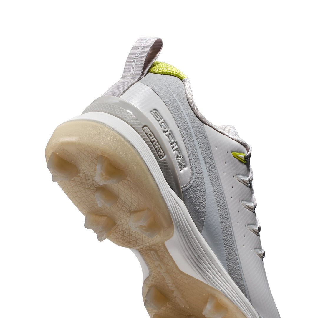 Heel cup on molded cleat in gray and white delivers comfort and stability    