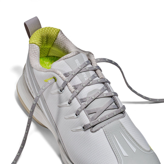 Close-up of the SQAIRZ Sta-Put lacing system on youth baseball and softball turf shoes, designed to keep laces securely tied while providing a locked-in fit throughout practices and games.
