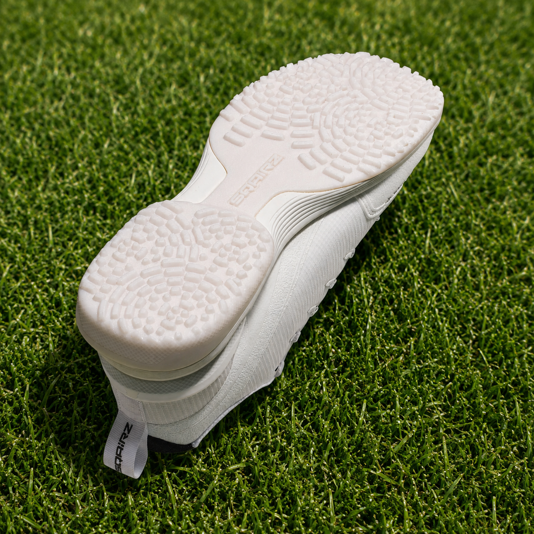 SQAIRZ GFP2 women's softball turf shoes in white designed for turf fields batting cages indoor training and softball practice