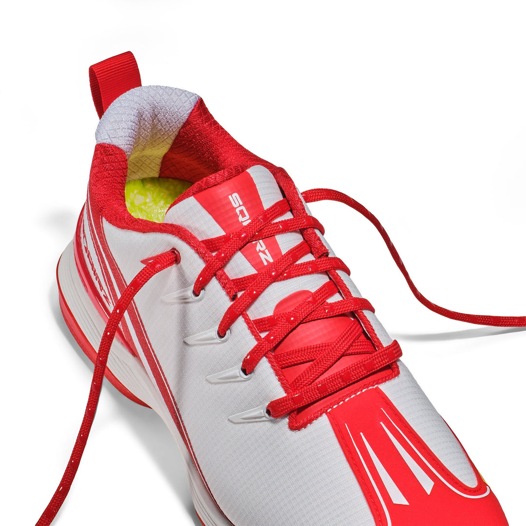 Red silicone nubs grip the shoe material and interlock against each other, ensuring the laces stay tightly secured