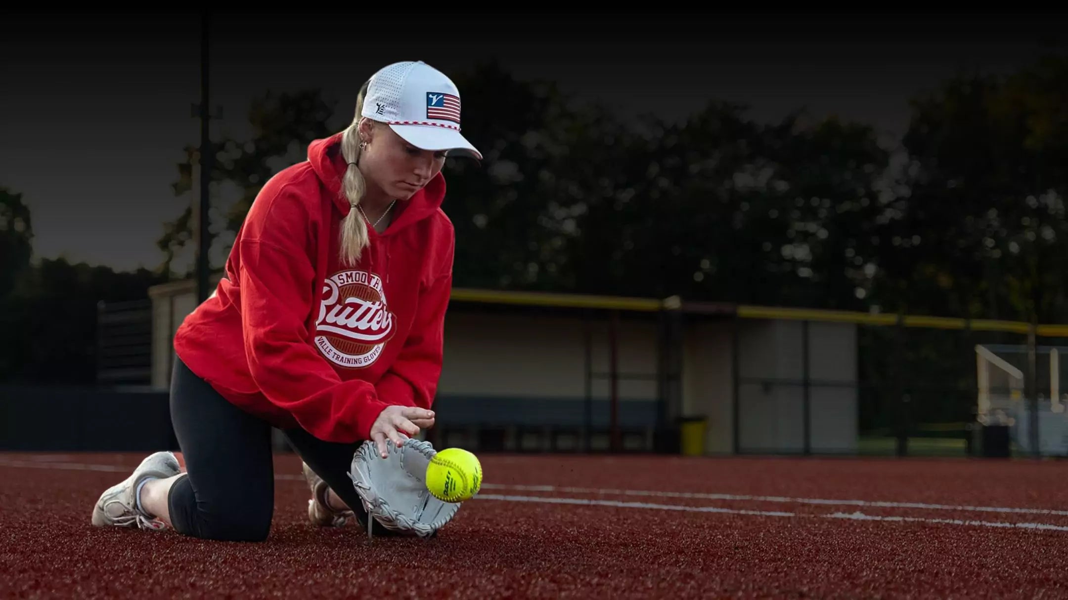 Softball athlete practicing with Valle glove trainer to enhance fielding technique and reaction time