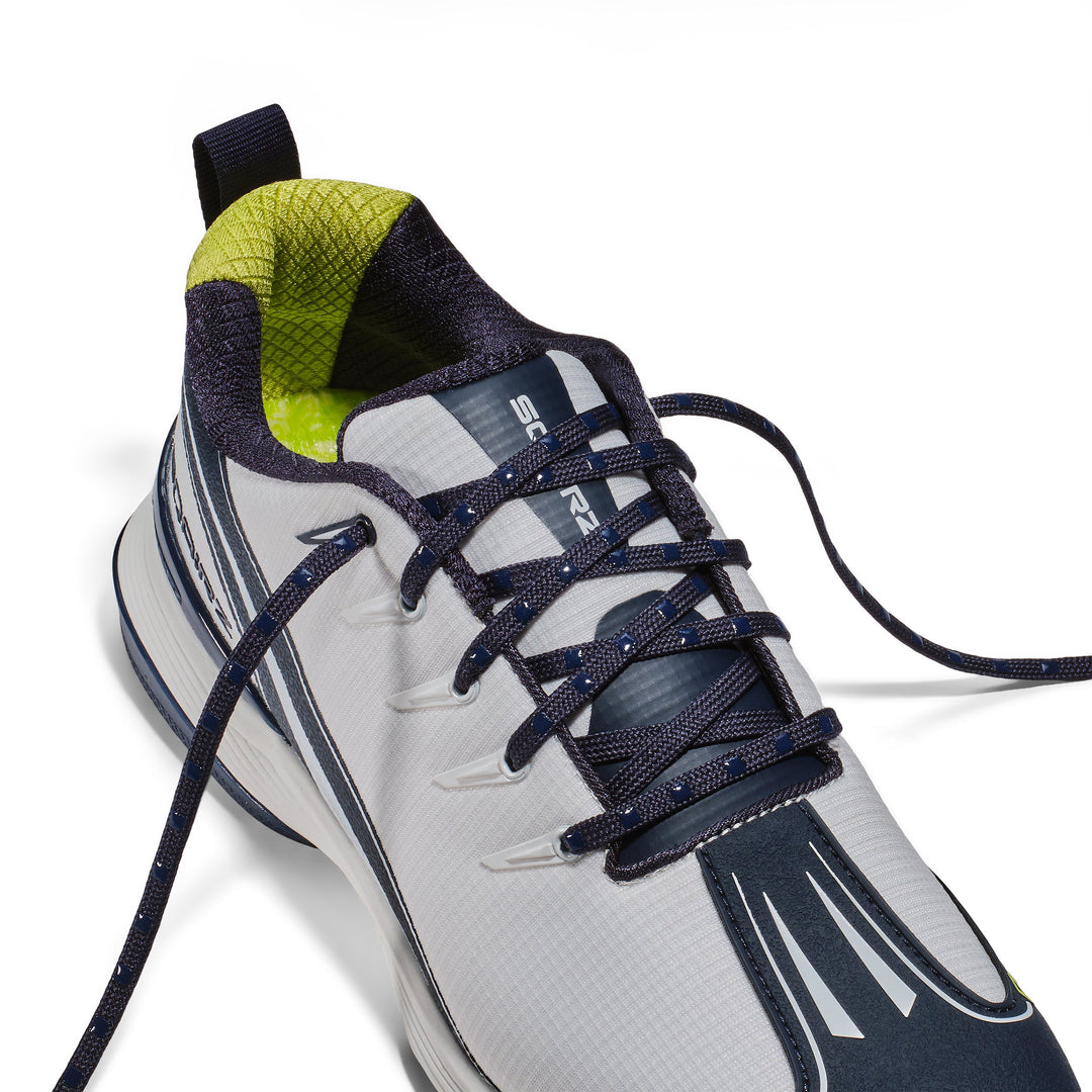 Silicone nubs grip the shoe material and interlock against each other 